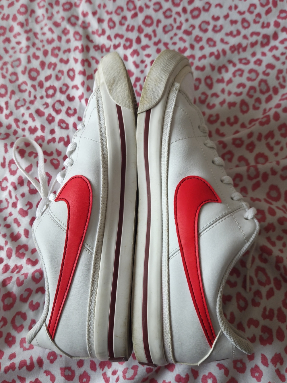 Nike Youth White Sneakers with Pink Swoosh